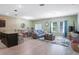 Open concept living room with a dining area, modern furnishings, and bright natural light at 1096 Roberta Rd, Lake Wales, FL 33853