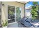 Covered patio area featuring a dining table and chairs, ideal for enjoying outdoor meals and gatherings at 1096 Roberta Rd, Lake Wales, FL 33853