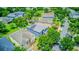 Aerial view showcases the home's location amidst lush greenery and well-kept neighborhood at 12715 Moss Park Ridge Dr, Orlando, FL 32832