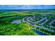 Community aerial with serene lakes surrounded by lush trees, highlighting natural beauty at 12715 Moss Park Ridge Dr, Orlando, FL 32832