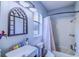 Bathroom with a stylish mirror, modern vanity, and shower-tub combo at 12715 Moss Park Ridge Dr, Orlando, FL 32832