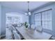 Dining room featuring a neutral palette and large windows at 12715 Moss Park Ridge Dr, Orlando, FL 32832