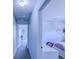 Hallway leading to bedrooms and office area at 12715 Moss Park Ridge Dr, Orlando, FL 32832