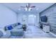 Comfortable living room features a modern design with a sectional sofa and a large TV at 12715 Moss Park Ridge Dr, Orlando, FL 32832