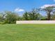 Spacious backyard with lush green grass and a secure fence for privacy at 1278 Asher Mason Ave, Kissimmee, FL 34744