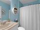 Inviting bathroom featuring stylish decor, neutral tiling, and bright lighting at 1278 Asher Mason Ave, Kissimmee, FL 34744