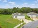 New construction home boasts manicured lawn and a symmetrical single-story facade at 1278 Asher Mason Ave, Kissimmee, FL 34744