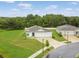 Picture of single Gathering home on a corner lot featuring a three car garage, fresh landscaping, and a well manicured lawn at 1278 Asher Mason Ave, Kissimmee, FL 34744