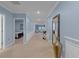 Bright hallway with blue walls, tiled floor, white trim, and tastefully decorated with elegant decor at 1278 Asher Mason Ave, Kissimmee, FL 34744