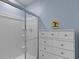 Clean shower with glass enclosure, tile, and storage cabinet at 1278 Asher Mason Ave, Kissimmee, FL 34744
