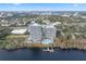 Stunning aerial view showcasing the two condo towers, lake, and surrounding landscape at 13415 Blue Heron Beach Dr # 401, Orlando, FL 32821
