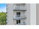 Exterior shot of building featuring multiple balconies with seating at 13415 Blue Heron Beach Dr # 401, Orlando, FL 32821