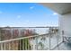 Enjoy lake views from this balcony featuring a pool and scenic landscapes at 13415 Blue Heron Beach Dr # 401, Orlando, FL 32821