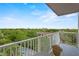 Enjoy the view from the balcony with seating and a beautiful cityscape at 13415 Blue Heron Beach Dr # 401, Orlando, FL 32821