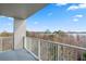 Relax on the balcony while enjoying the scenic views of lush greenery and a serene lake at 13415 Blue Heron Beach Dr # 401, Orlando, FL 32821