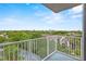 Balcony view showcasing lush greenery and the city skyline in the distance at 13415 Blue Heron Beach Dr # 401, Orlando, FL 32821