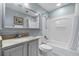 Bathroom with bathtub, vanity, and neutral paint at 13415 Blue Heron Beach Dr # 401, Orlando, FL 32821
