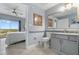 Bright, modern bathroom with a vanity and walk in closet, and neutral paint at 13415 Blue Heron Beach Dr # 401, Orlando, FL 32821