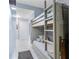 Cozy bunk beds in a bedroom with access to the hallway and laundry area at 13415 Blue Heron Beach Dr # 401, Orlando, FL 32821