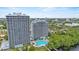 Exterior aerial shot featuring the pool and a view of the surrounding city at 13415 Blue Heron Beach Dr # 401, Orlando, FL 32821