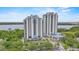 Stunning high-rise condominium with balconies overlooking lush greenery and serene water views, plus ample parking at 13415 Blue Heron Beach Dr # 401, Orlando, FL 32821