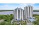 Aerial view of two high-rise condo buildings and surrounding landscape at 13415 Blue Heron Beach Dr # 401, Orlando, FL 32821