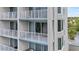 Condominium exterior featuring multiple balconies with seating and views at 13415 Blue Heron Beach Dr # 401, Orlando, FL 32821
