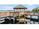 Charming gazebo by the lake, perfect for relaxing and enjoying scenic views at 13415 Blue Heron Beach Dr # 401, Orlando, FL 32821