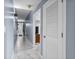 Hallway with marble tile floors, and a view to other rooms in the home at 13415 Blue Heron Beach Dr # 401, Orlando, FL 32821