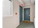 Hallway leading to rooms featuring an exit sign, doors, and sprinkler system at 13415 Blue Heron Beach Dr # 401, Orlando, FL 32821