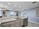 Granite countertops and stainless steel appliances highlight this modern kitchen area at 13415 Blue Heron Beach Dr # 401, Orlando, FL 32821