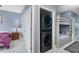 Modern in-unit laundry area and convenient access to a bedroom with bunk beds at 13415 Blue Heron Beach Dr # 401, Orlando, FL 32821