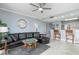 Cozy living room featuring a sleek leather sofa, modern furnishings, and easy access to the kitchen at 13415 Blue Heron Beach Dr # 401, Orlando, FL 32821