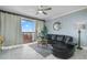 Open-concept living room with balcony access, providing a view of the outdoor scenery at 13415 Blue Heron Beach Dr # 401, Orlando, FL 32821