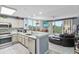 Spacious living room showcasing an open floor plan with kitchen and dining areas at 13415 Blue Heron Beach Dr # 401, Orlando, FL 32821