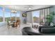 Bright living room with large windows, access to balcony, dining area, and comfortable seating at 13415 Blue Heron Beach Dr # 401, Orlando, FL 32821