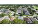 Wide aerial view of residential neighborhood with mature trees and manicured landscaping at 1426 Park Park, Haines City, FL 33844