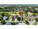 Golf course home showcasing serene community living and a well-manicured lawn at 1426 Park Park, Haines City, FL 33844