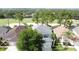 This home offers golf course views, mature trees, and a manicured lawn at 1426 Park Park, Haines City, FL 33844