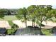 The backyard has a screened-in lanai with golf course views at 1426 Park Park, Haines City, FL 33844