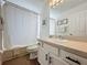 Bright bathroom features a shower-tub combination and a modern vanity, creating a clean and functional space at 1426 Park Park, Haines City, FL 33844