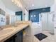 Well-lit bathroom featuring double sinks, walk-in shower, and a luxurious soaking tub at 1426 Park Park, Haines City, FL 33844