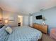 Spacious bedroom with light walls, a wall-mounted TV, and carpeted floors at 1426 Park Park, Haines City, FL 33844