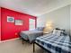 Bedroom featuring two twin beds, carpet, and decoratively painted walls at 1426 Park Park, Haines City, FL 33844