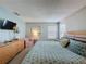 Bedroom featuring stylish furnishings, wall-mounted TV, and carpeted flooring at 1426 Park Park, Haines City, FL 33844