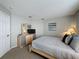 This bedroom is clean and uncluttered and features neutral paint, carpeting, and decor to make the space feel open and bright at 1426 Park Park, Haines City, FL 33844