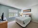 This bedroom provides clean, uncluttered rest and recreation featuring neutral paint and carpet, and a light airy ambience at 1426 Park Park, Haines City, FL 33844