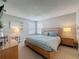 Comfortable bedroom with carpet, neutral walls, and a large window with blinds at 1426 Park Park, Haines City, FL 33844