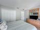 This bedroom is clean and uncluttered and features neutral paint, carpeting, and decor to make the space feel open and bright at 1426 Park Park, Haines City, FL 33844