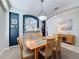 Inviting dining room featuring a wooden table, elegant light fixture, and stylish decor touches at 1426 Park Park, Haines City, FL 33844